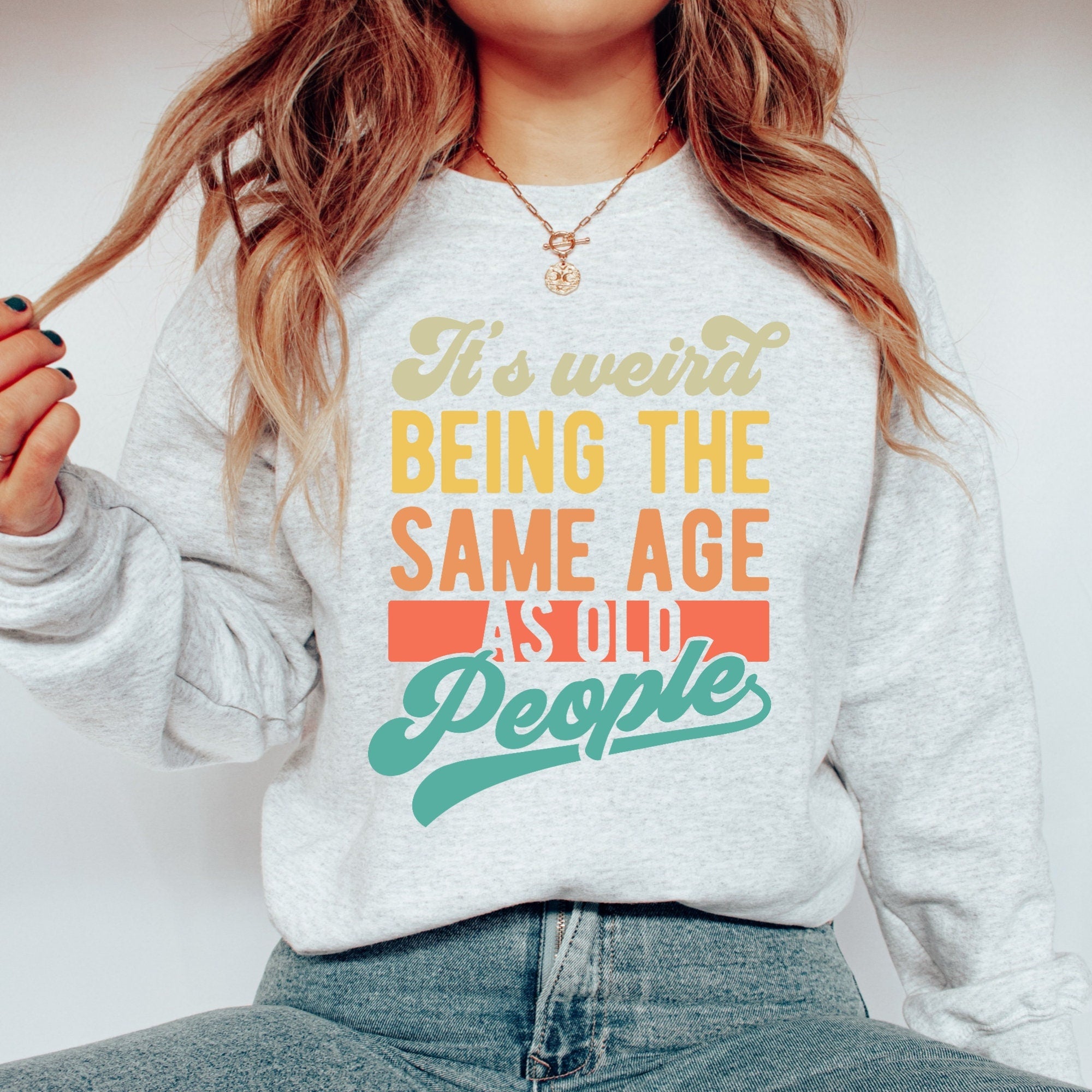 Men's Women's "It's Weird Being The Same Age As Old People" Unisex Heavy Blend™ Crewneck Sweatshirt In The Color Ash