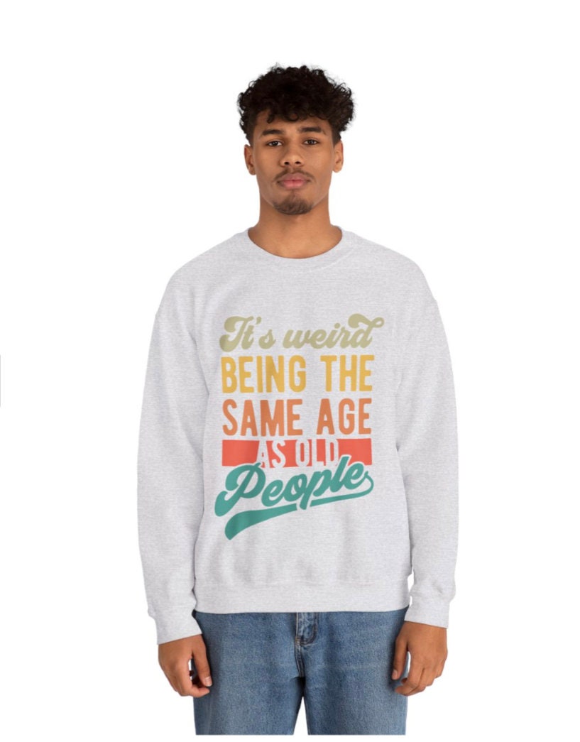 Men's Women's "It's Weird Being The Same Age As Old People" Unisex Heavy Blend™ Crewneck Sweatshirt In The Color Ash