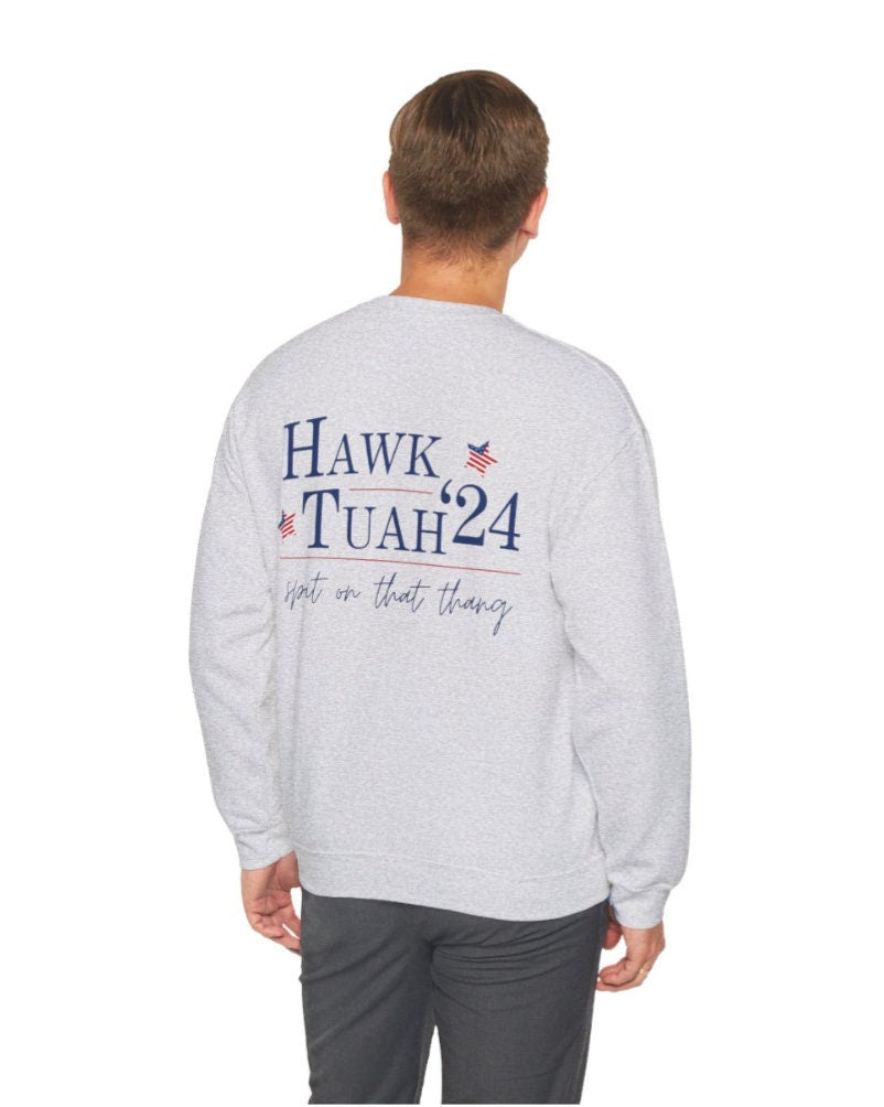 Men's Women's Unisex Fit "Hawk Tuah '24 Spit On That Thang" On Back & Front Corner, Heavy Blend™ Crewneck Sweatshirt In The Color Ash